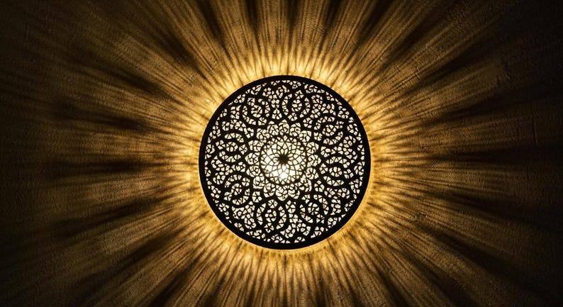 Moroccan round brass wall light